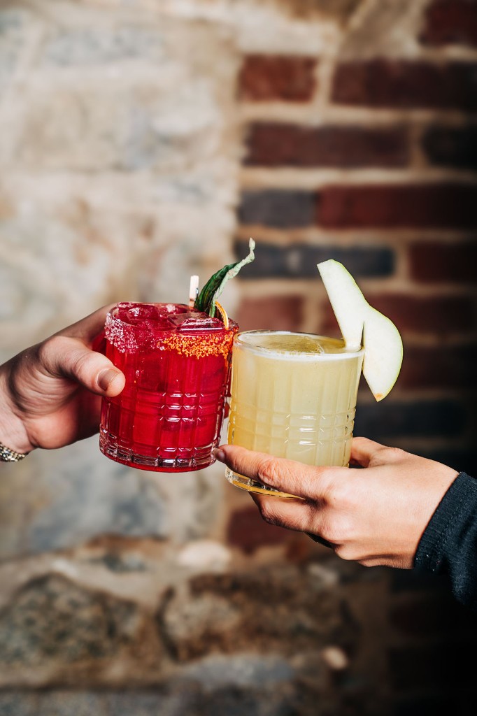 Guests toast craft cocktails at a private Stone House Nevada City event