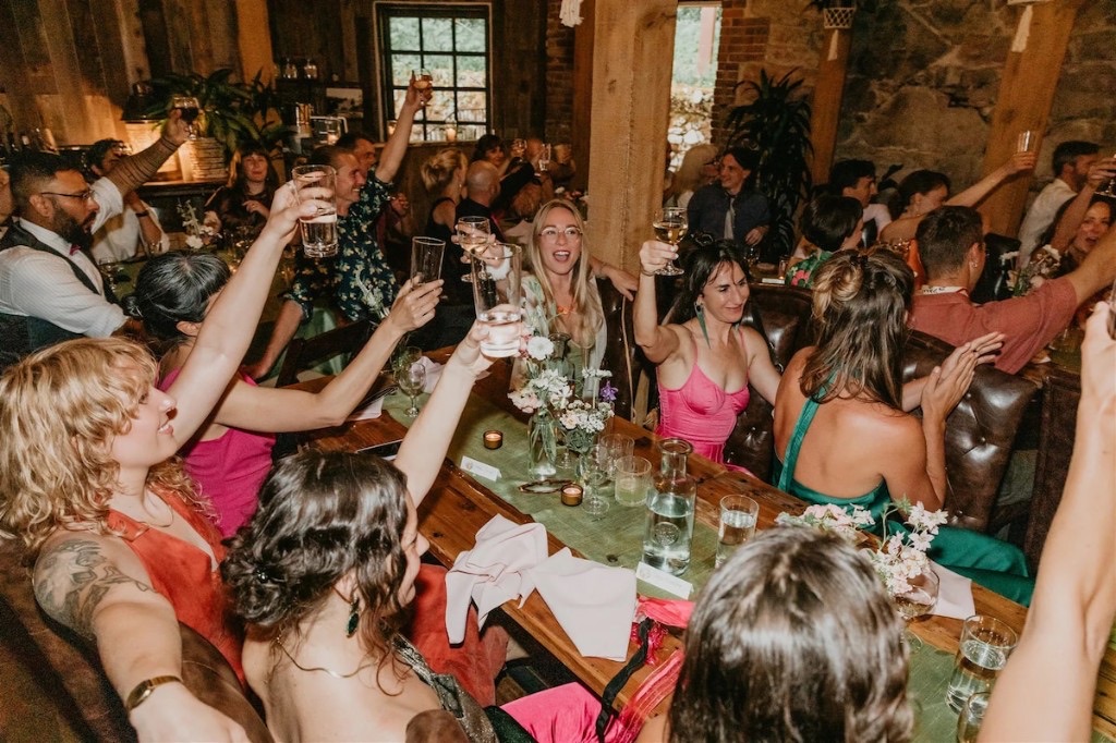 Wedding reception toast with guests at Stone House Nevada City