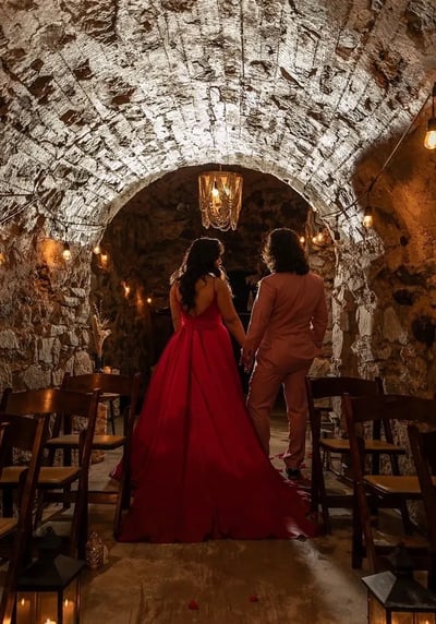 Intimate wedding moment in The Cavern at Stone House Nevada City — original 1800s stone cave