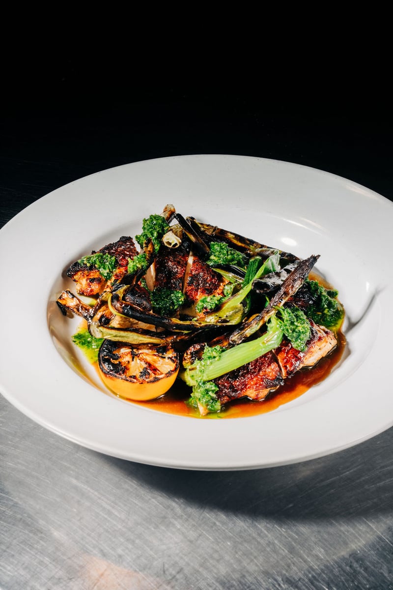 Roasted chicken entree with seasonal carrots plated for a private wedding dinner at Stone House Nevada City — chef-curated menu