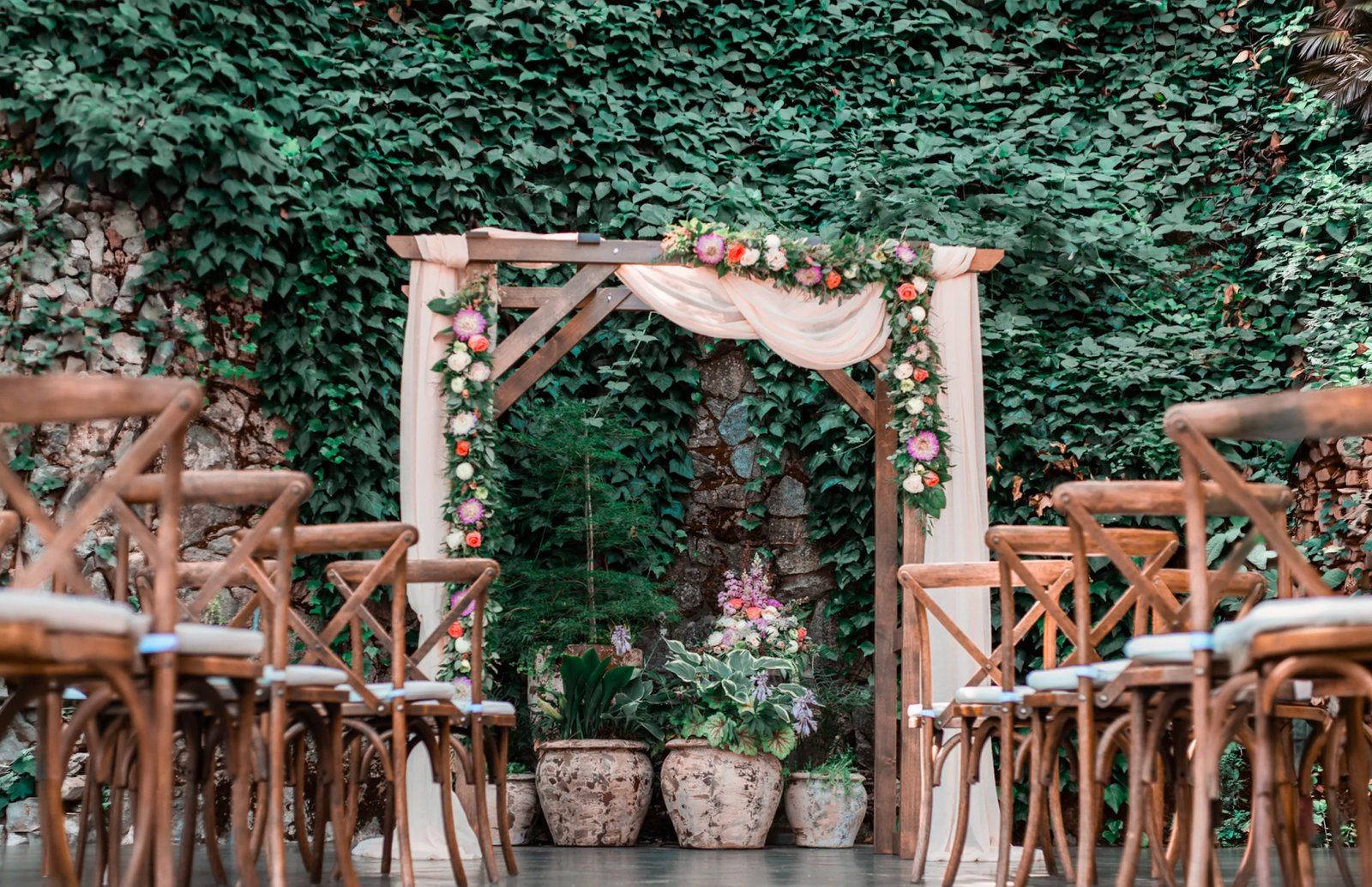Stone-walled outdoor courtyard at Stone House Nevada City — string-lit ceremony or cocktail-hour space framed by 1857 architecture