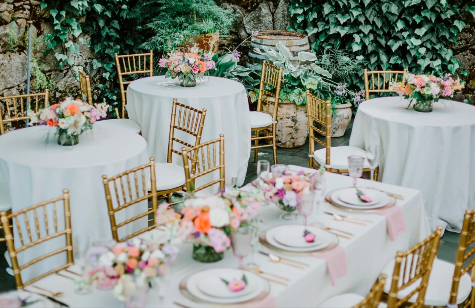 Styled wedding shoot in The Courtyard at Stone House Nevada City — outdoor stone-walled venue and golden light