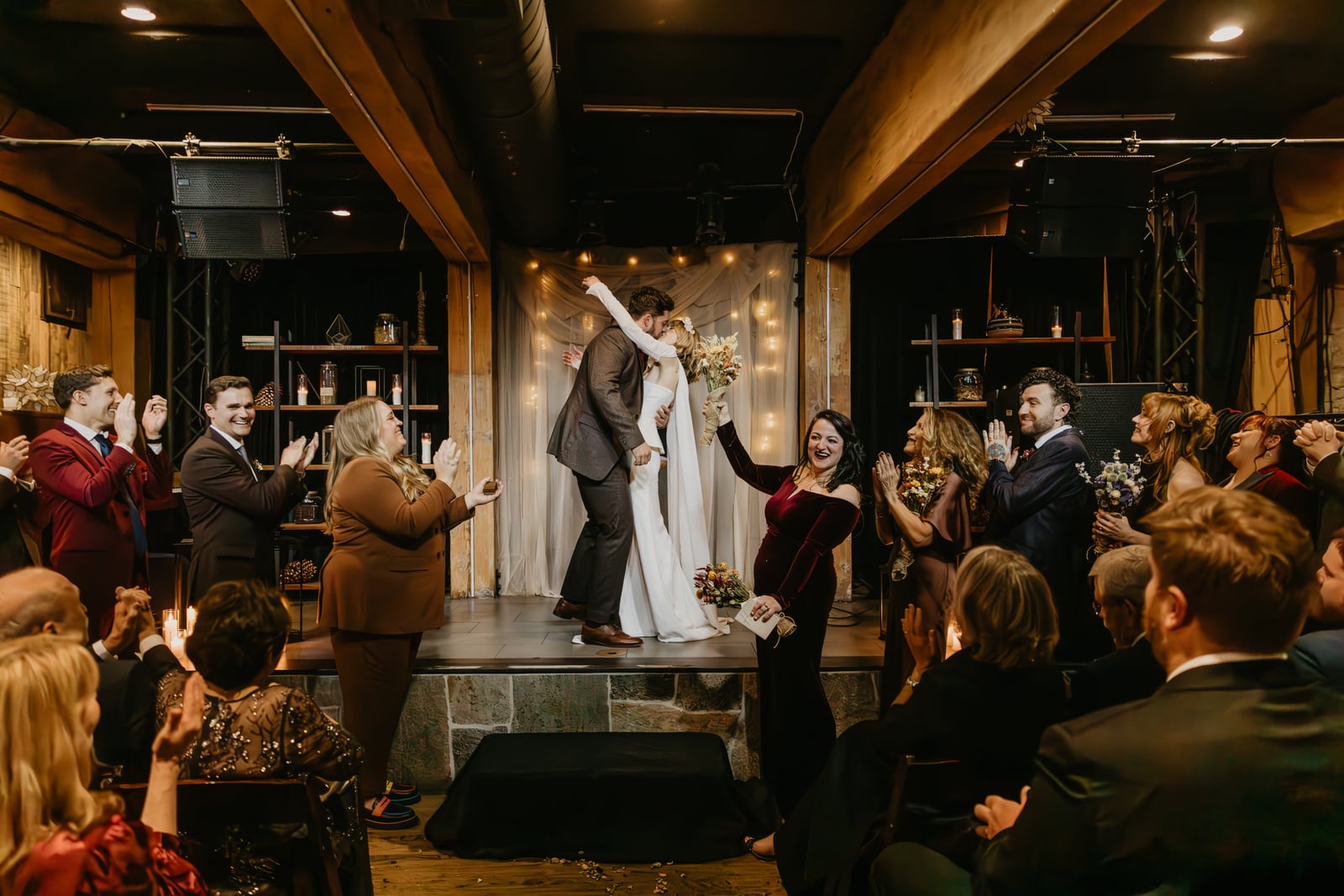 Wedding reception in The Showroom at Stone House Nevada City — first-floor flexible event space with exposed beams