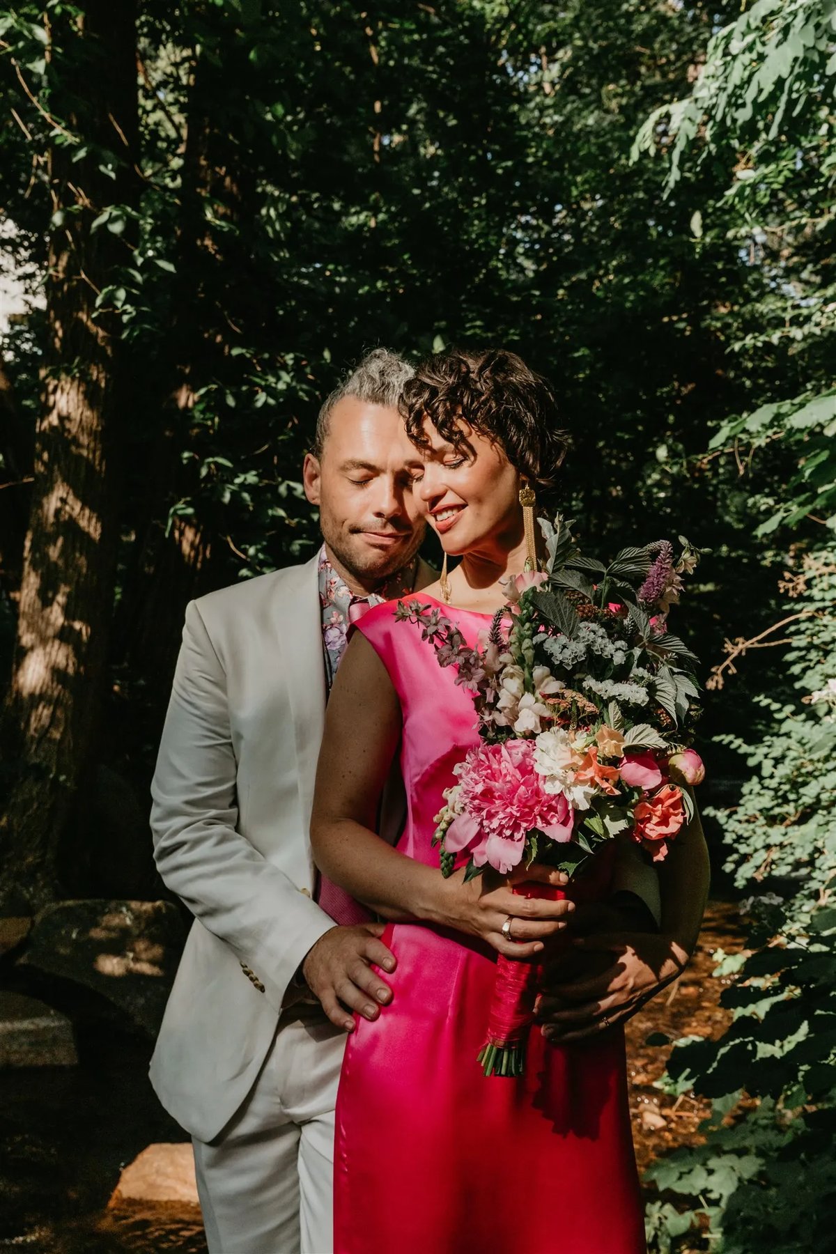 Bride and groom photographed at Stone House Nevada City — historic 1857 venue with original stonework as the wedding ceremony backdrop